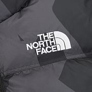 North Face x KAWS Retro 1996 Nuptse jacket in black.  - 2