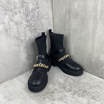 Chanel short boots with a chain