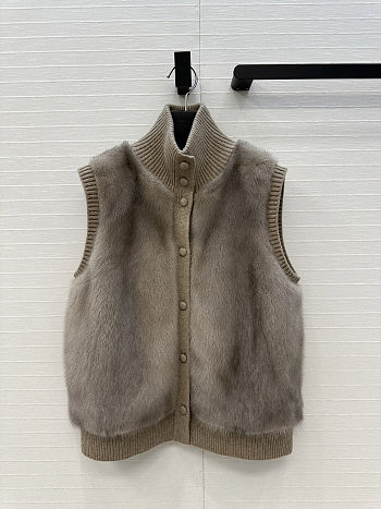 LP style brown fur vest with a ribbed knit turtleneck 