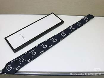 Gucci GG logo tie in navy blue.