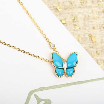 Van Cleef & Arpels Two Butterfly pendant in yellow gold with turquoise