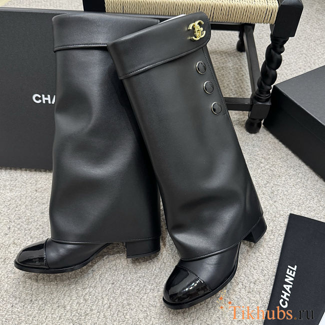 Chanel black leather fold-over boots with a cap toe and button details  - 1