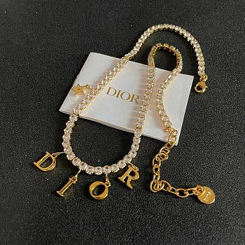 Dior evolution necklace in gold-finish metal and white crystals. 