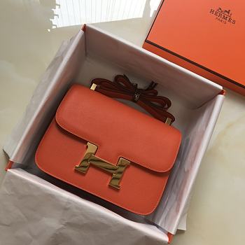 Hermès Constance 18 bag, featuring orange leather with gold hardware 