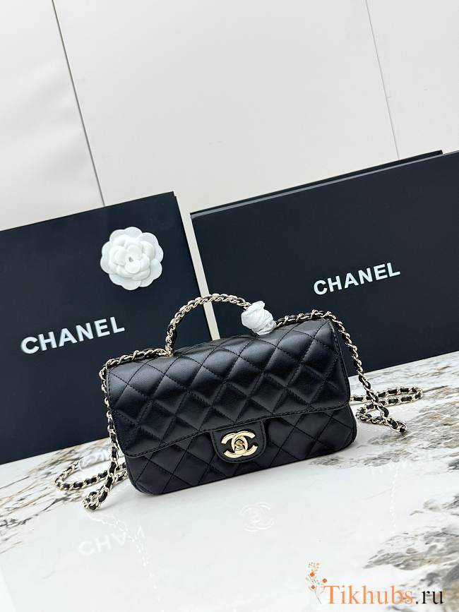 Chanel Mini Classic handbag in black has a handle embellished with rhinestones size 20x7x12 cm - 1