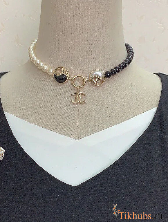 Chanel necklace is the A23C Pearl Coco Mark  - 1
