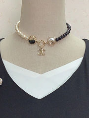 Chanel necklace is the A23C Pearl Coco Mark  - 1