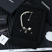 Chanel necklace is the A23C Pearl Coco Mark  - 2