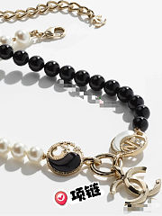 Chanel necklace is the A23C Pearl Coco Mark  - 5