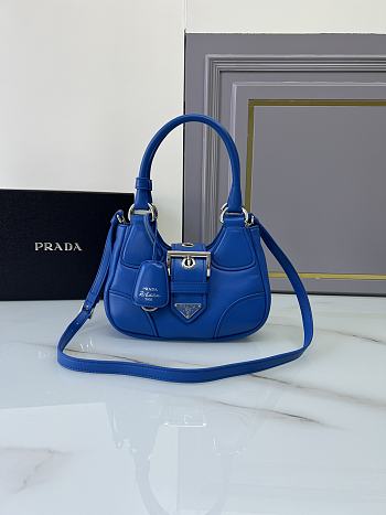 Prada Re-Edition 2002 bag is featured in a striking blue leather 22.5x16x7.5cm