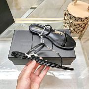 Saint Laurent Cassandra flat sandals in black patent leather - 6