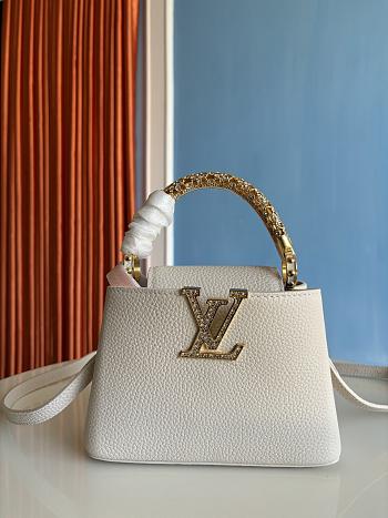 Louis Vuitton Capucines mini handbag in powder beige with crystal-embellished logo 13.6x8x21 cm.
